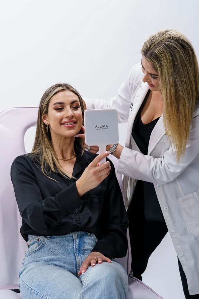 injector giving a client a botox consultation