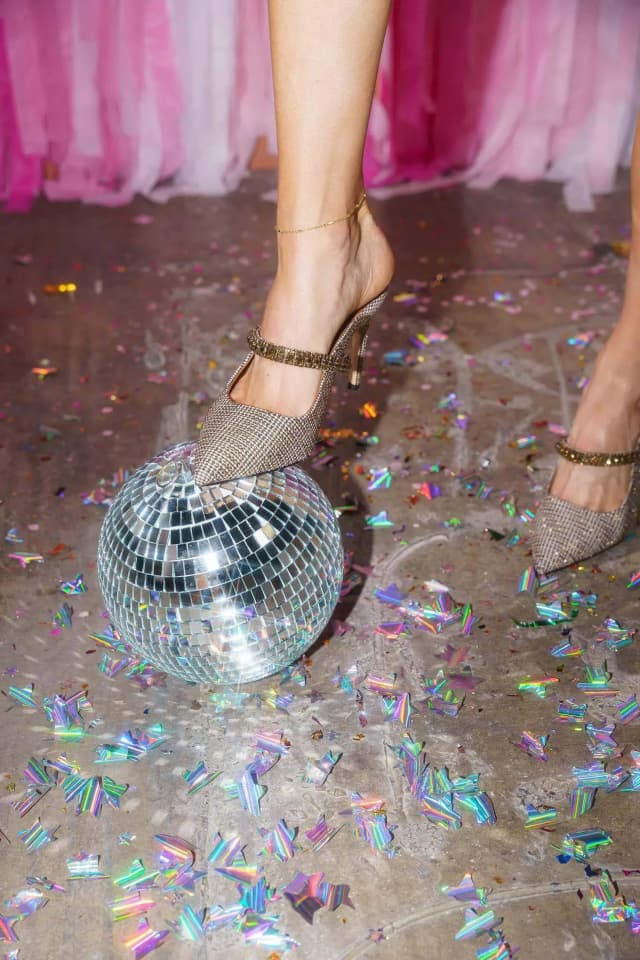 sparkly heels on top of a disco ball